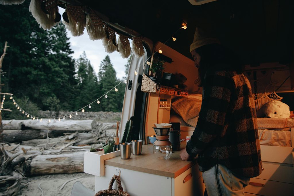 Preparing coffee in camper van