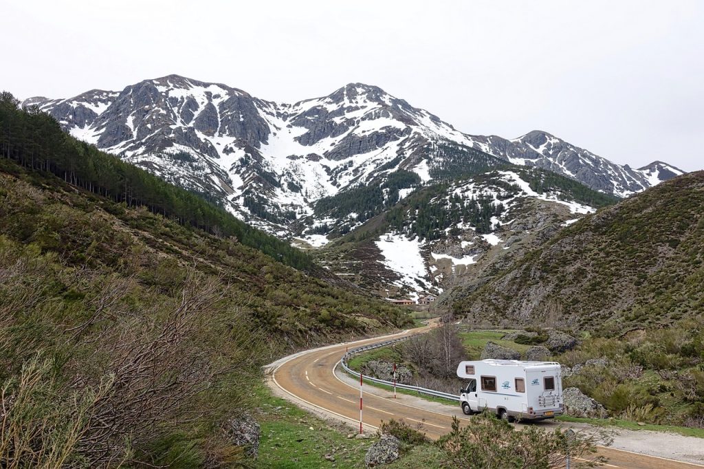 An inspiring image of an RV journeying into a scenic landscape