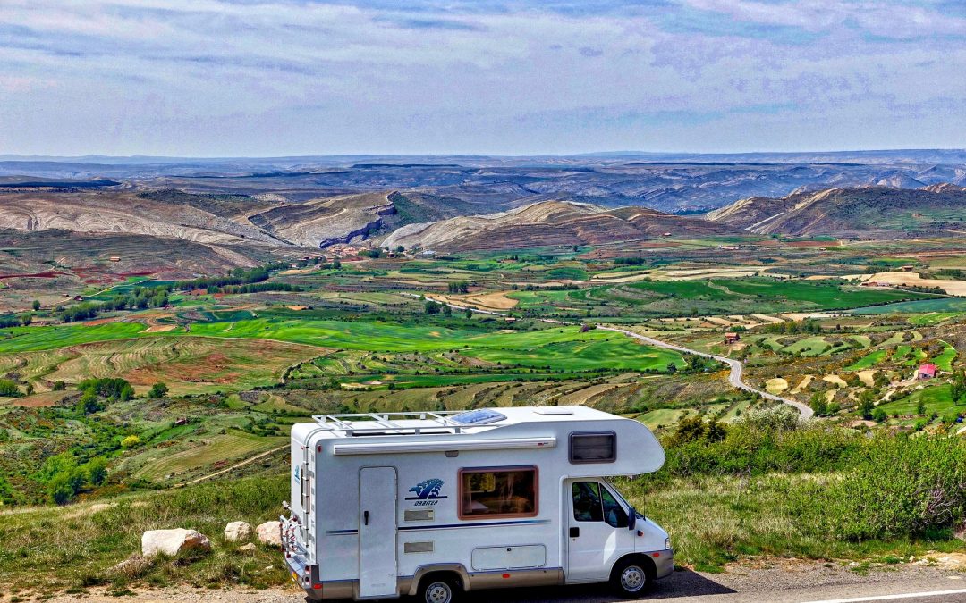 RV set up in a remote, picturesque mountain landscape