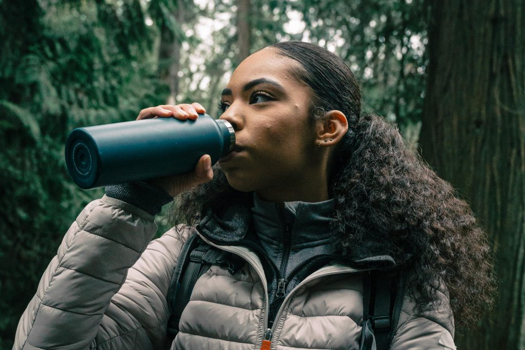 Female Hiker Drinking from Water Bottle