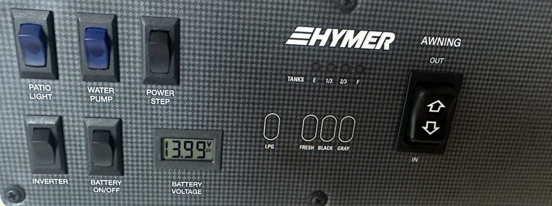 Hymer Aktiv control panel with inverter, water pump and battery voltage reading 13.99 volts