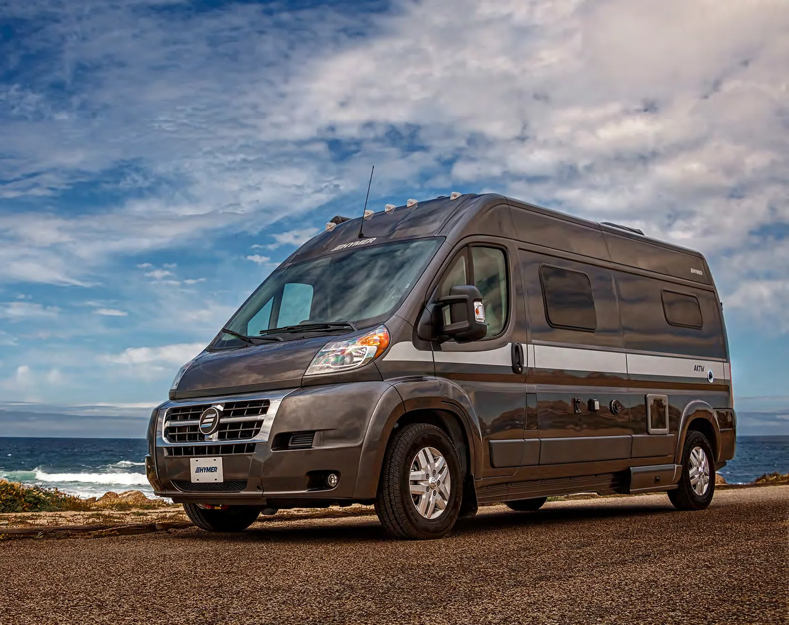Hymer Aktiv Class B camper van parked on a coastal overlook