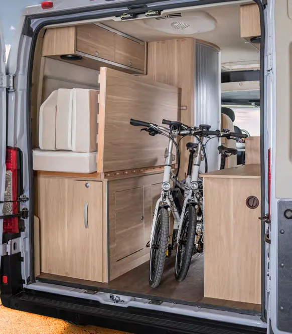 Two bikes stored in the rear garage of a Hymer Aktiv Class B